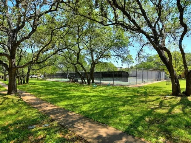 a view of an outdoor space and tennis court
