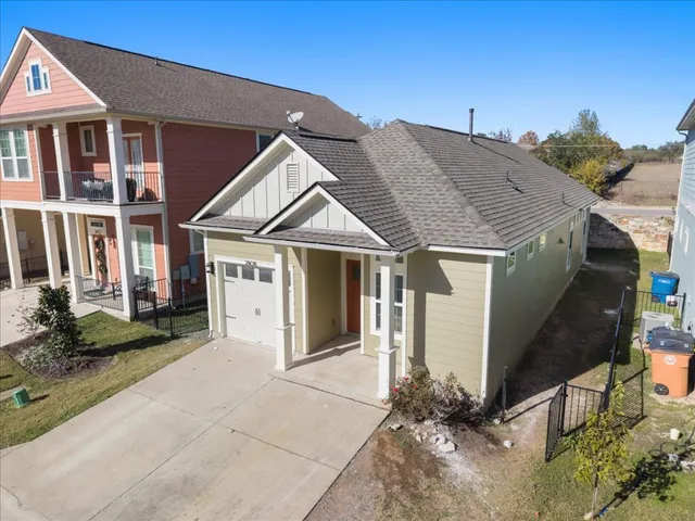 an aerial view of ocean residential house with outdoor space and swimming pool