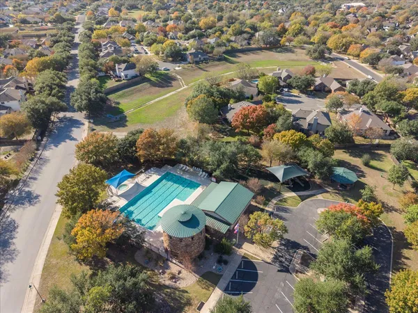 an aerial view of ocean residential house with outdoor space and swimming pool