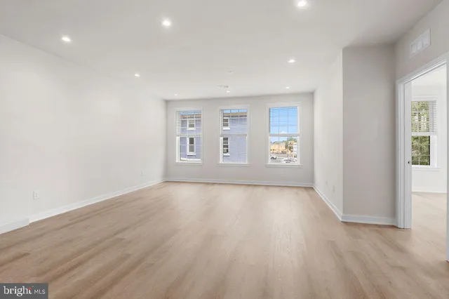 a view of a kitchen with a sink and a stove top oven