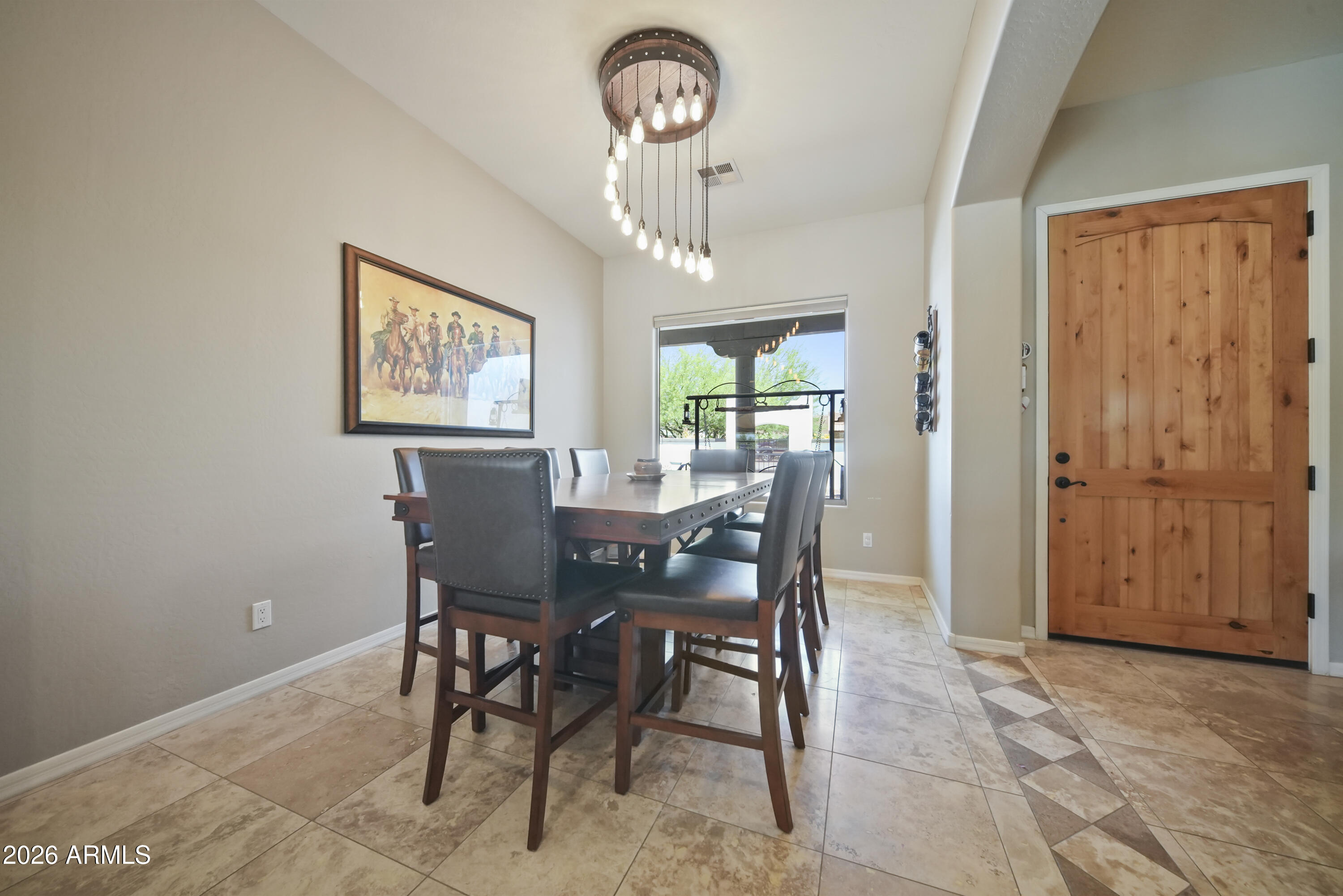 605 West Ridgecrest Road Phoenix, AZ 85086 - Photo 15 of 40 a view of a dining room with furniture and a chandelier