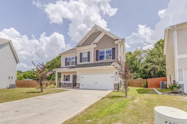 a front view of a house with garden