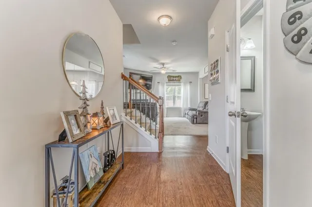 a view of an entryway with wooden floor