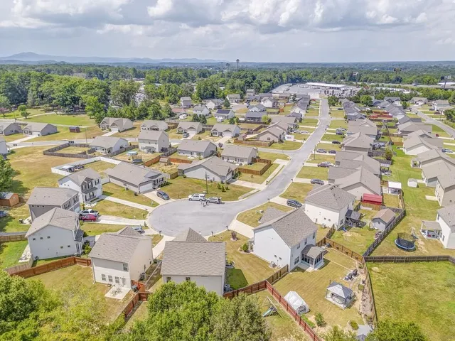 an aerial view of residential house with outdoor space