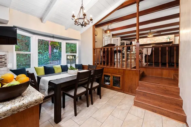 a dining room with furniture and wooden floor