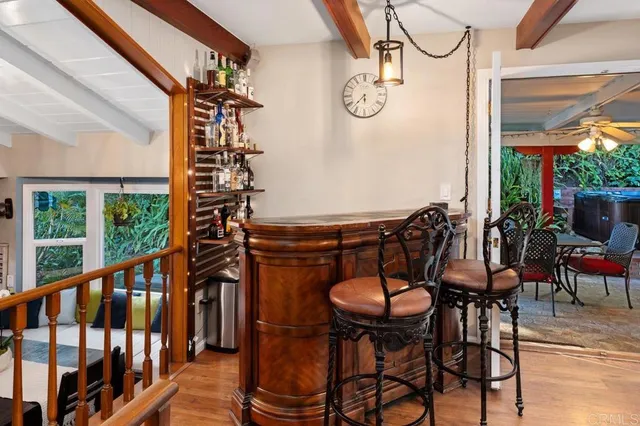 a view of a chairs and table in the balcony