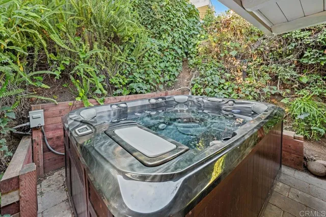 a view of a swimming pool with a patio and a yard