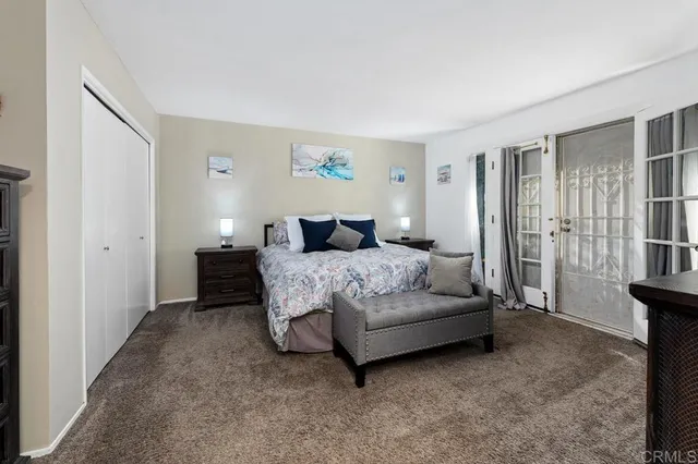 a bedroom with a bed and with furniture