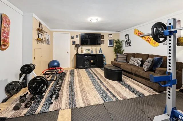 a bedroom with a bed and a tv