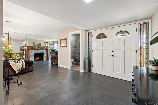 a view of a livingroom with furniture and fireplace