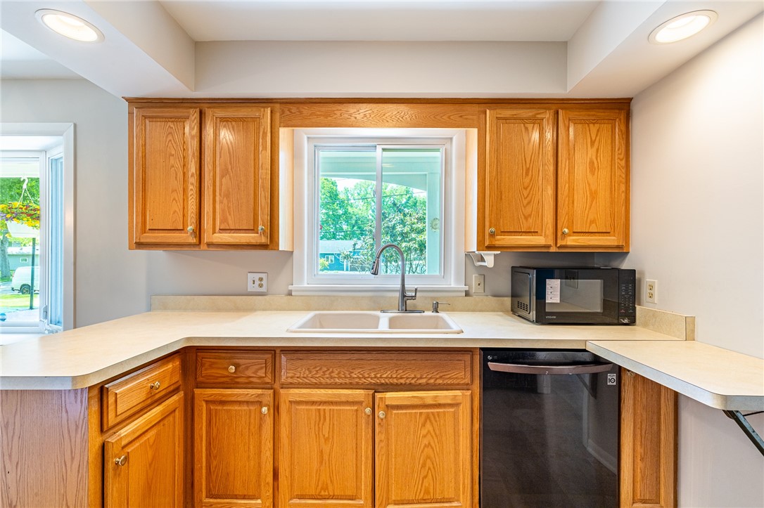 274 Parkview Drive Rochester, NY 14625 - Photo 9 of 41 Kitchen front window, sink and counter areas