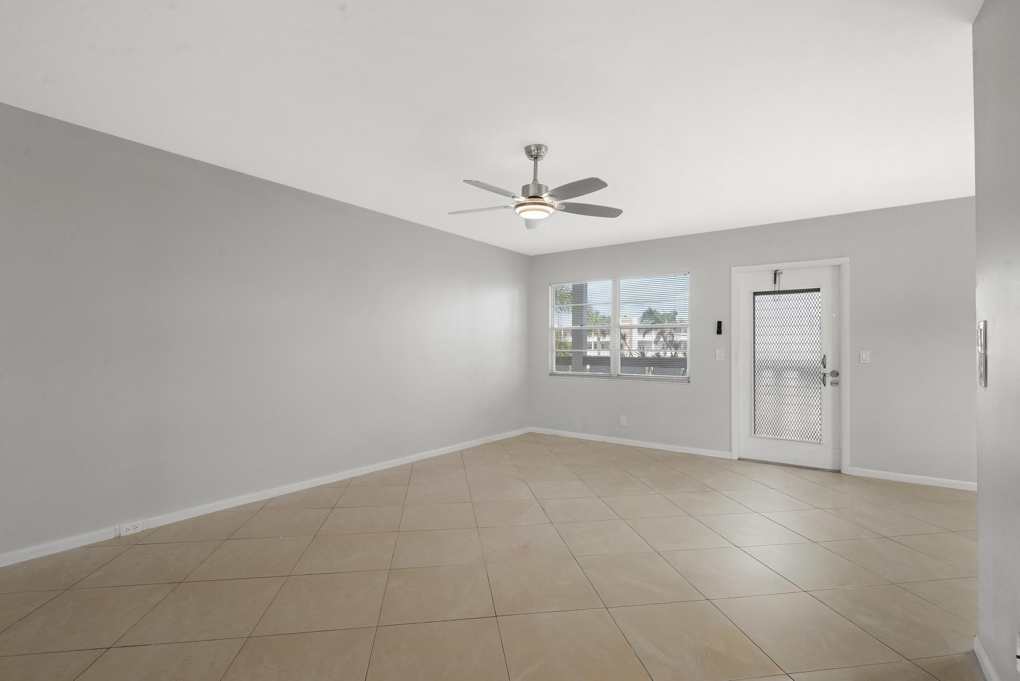 3038 Cornwall East, Unit 3038 Boca Raton, FL 33434 - Photo 11 of 32 an empty room with closet and windows