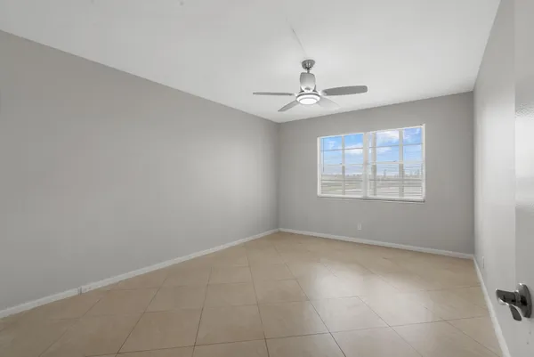 a view of an empty room with windows
