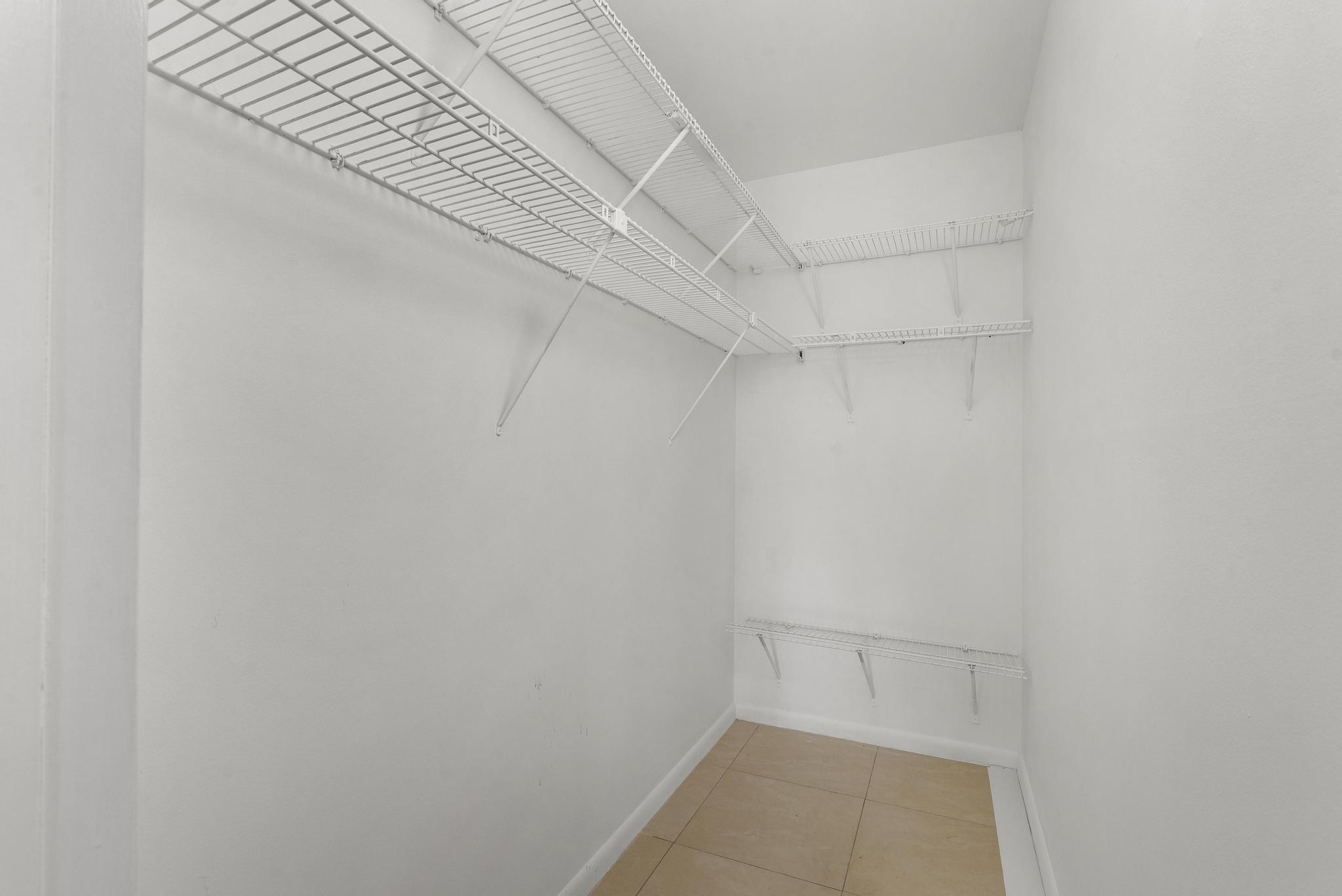 3038 Cornwall East, Unit 3038 Boca Raton, FL 33434 - Photo 17 of 32 a view of an empty walk in closet