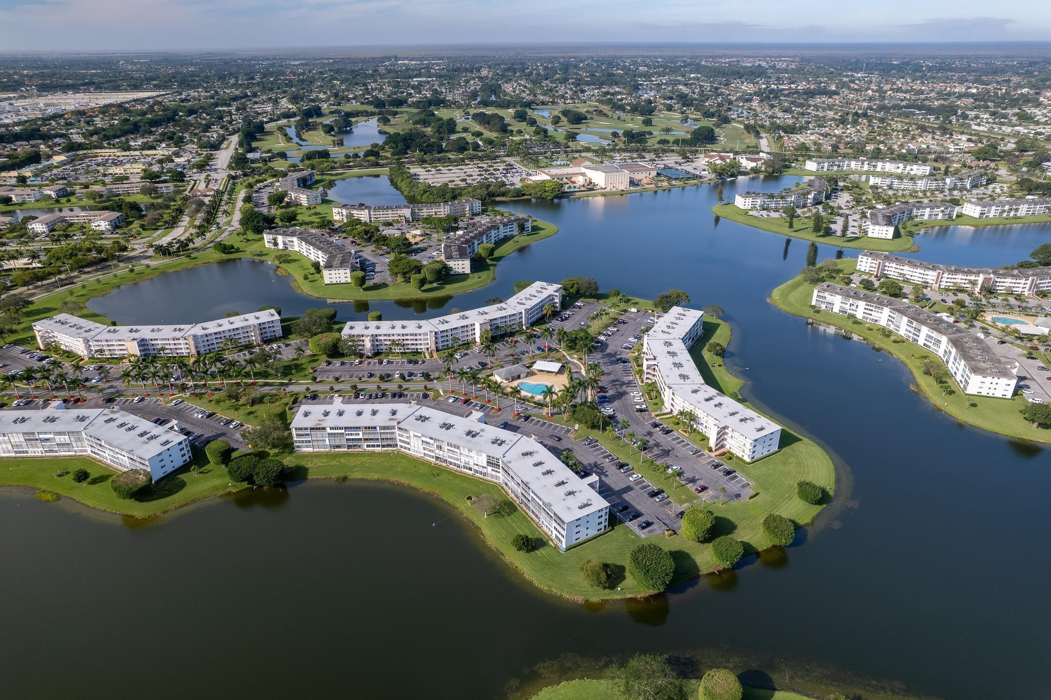3038 Cornwall East, Unit 3038 Boca Raton, FL 33434 - Photo 30 of 32 an aerial view of a house with a lake view