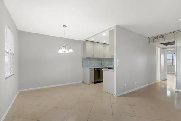a view of a kitchen with a sink and a window