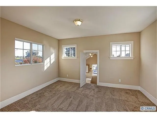 a view of empty room with windows