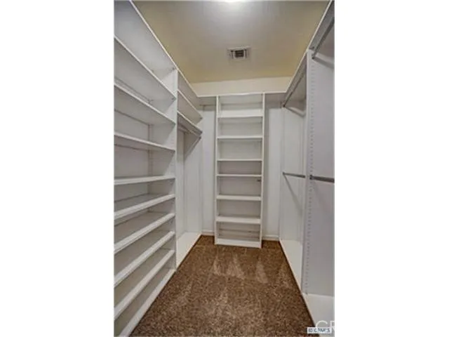 a view of a room with a staircase and a fireplace