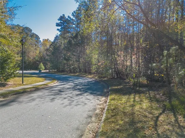 a view of yard with swimming pool and basket ball court