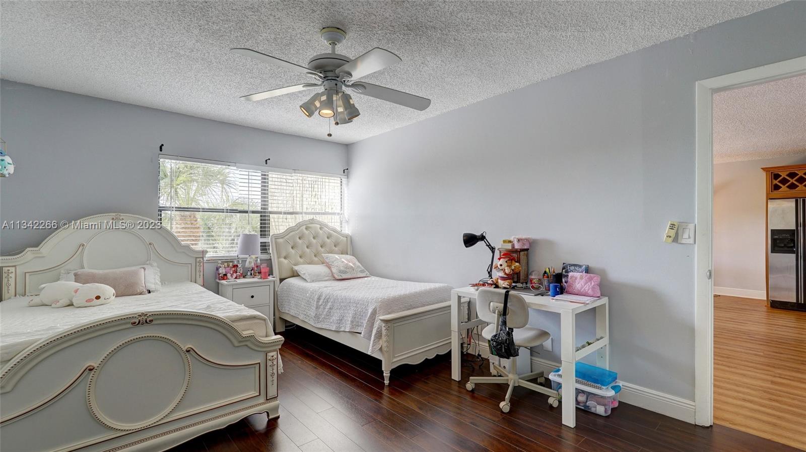 Racquet Club Apartments at Bonaventure Weston, FL 33326 - Photo 11 of 26 a bedroom with furniture and a window