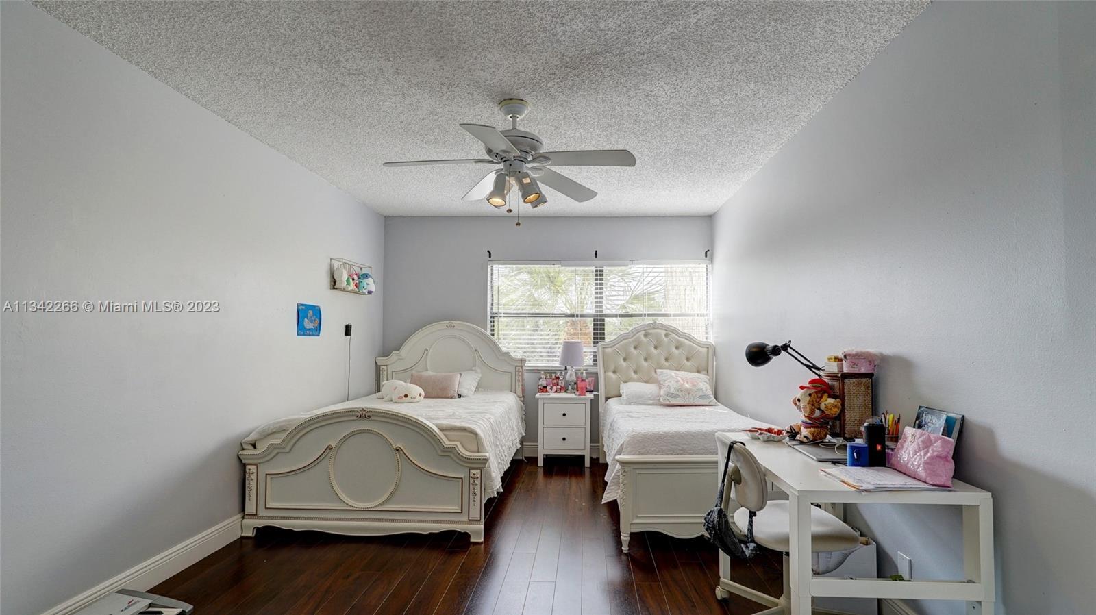 Racquet Club Apartments at Bonaventure Weston, FL 33326 - Photo 12 of 26 a bedroom with furniture and a window