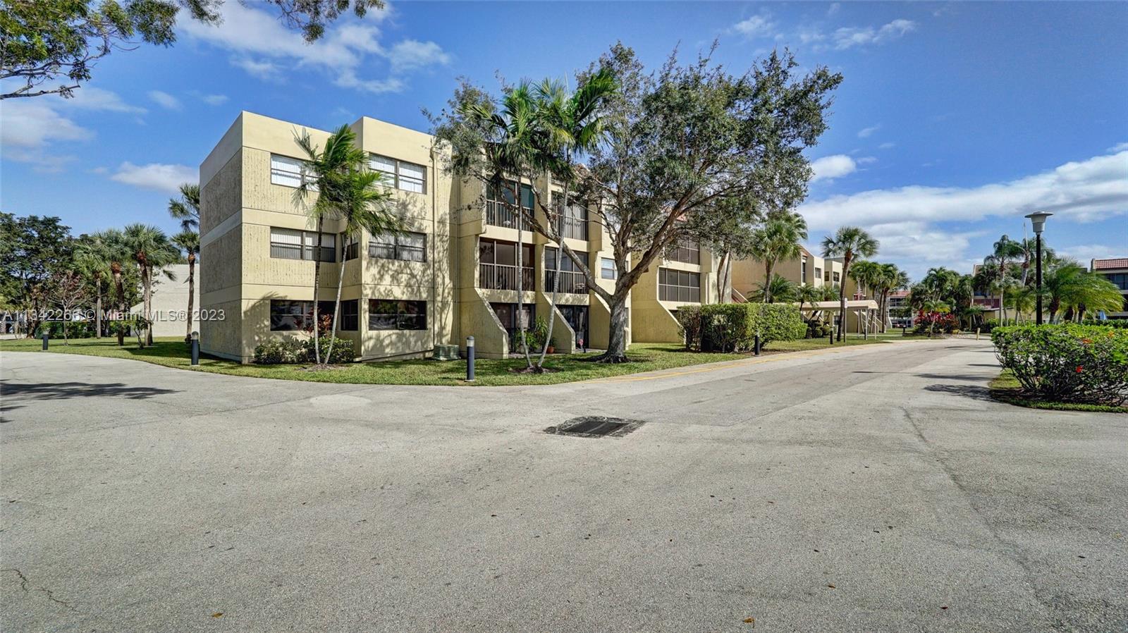 Racquet Club Apartments at Bonaventure Weston, FL 33326 - Photo 20 of 26 front view of a house with a street