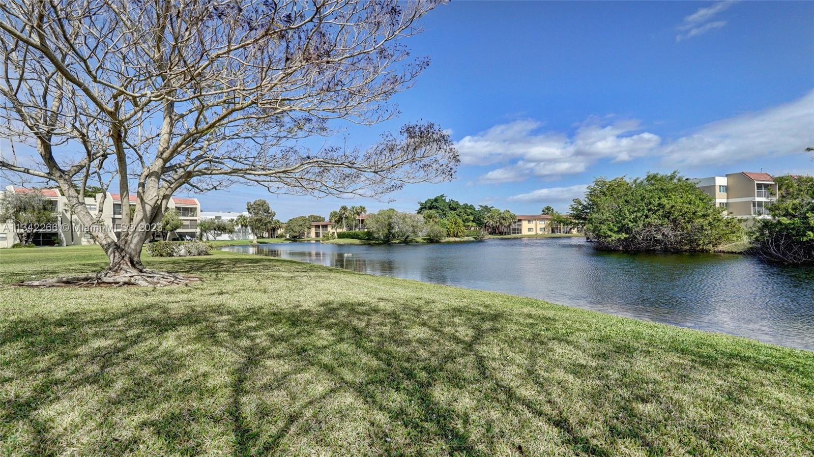 Racquet Club Apartments at Bonaventure Weston, FL 33326 - Photo 24 of 26 a view of lake with houses