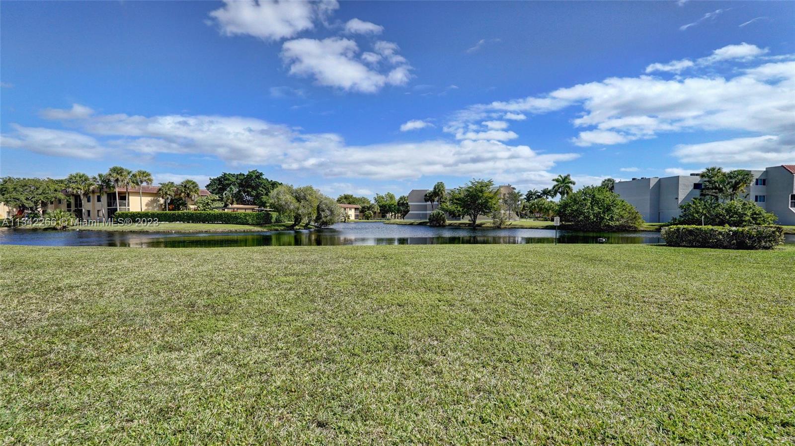 Racquet Club Apartments at Bonaventure Weston, FL 33326 - Photo 26 of 26 a view of outdoor space with green field and trees