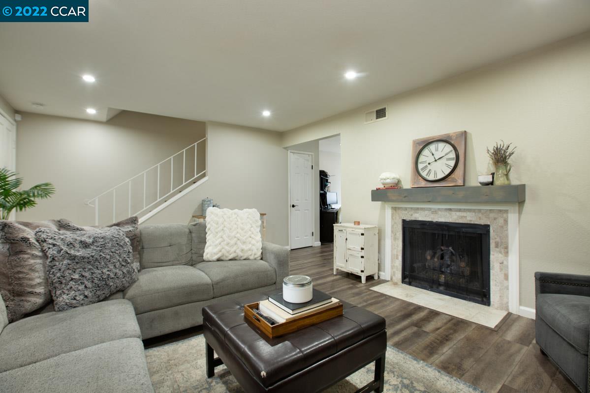 476 Sycamore Circle Danville, CA 94526 - Photo 1 of 1 a living room with furniture and a fireplace