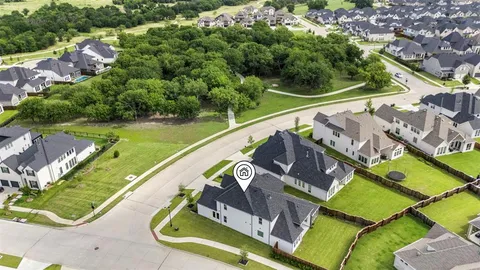 an aerial view of a house with a garden and swimming pool