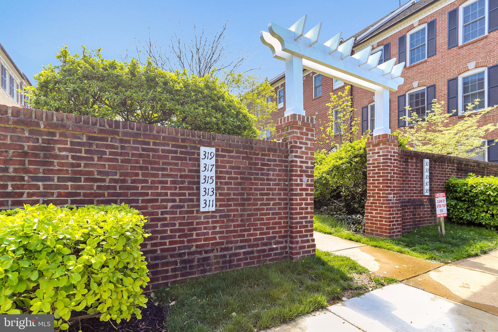 313 Ridgepoint Place Gaithersburg, MD 20878 - Photo 4 of 52 a front view of a house with a yard