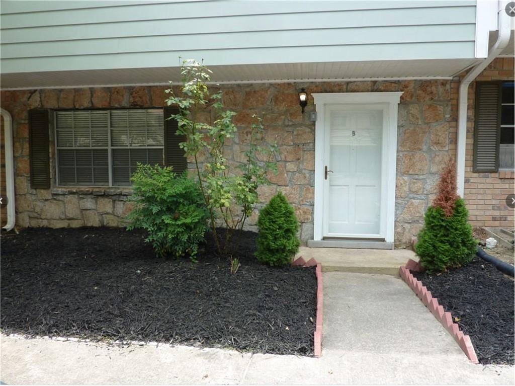 4701 Flat Shoals Road, Unit 59B Union City, GA 30291 - Photo 2 of 3 a view of a house with a garden