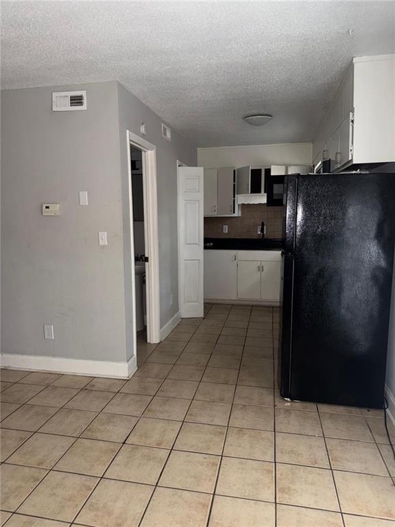 4701 Flat Shoals Road, Unit 59B Union City, GA 30291 - Photo 5 of 13 a kitchen with stainless steel appliances granite countertop a refrigerator and a stove