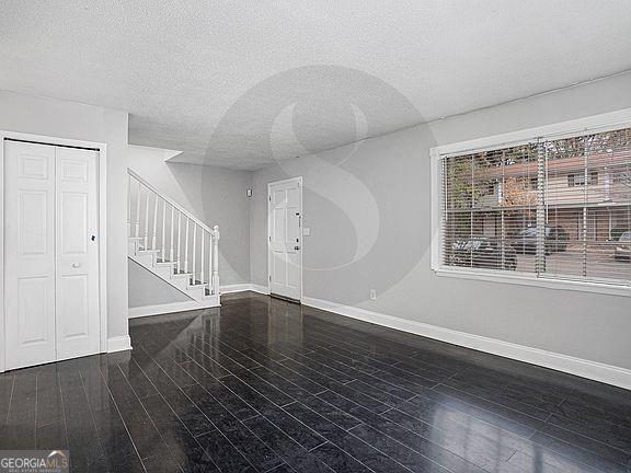 4701 Flat Shoals Road, Unit 59B Union City, GA 30291 - Photo 7 of 9 wooden floor in an empty room with a window