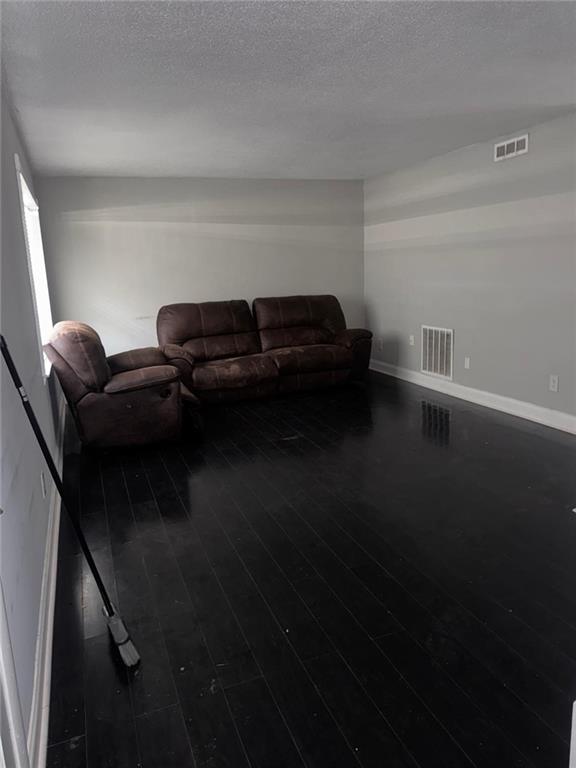4701 Flat Shoals Road, Unit 59B Union City, GA 30291 - Photo 9 of 13 a living room with furniture and a rug