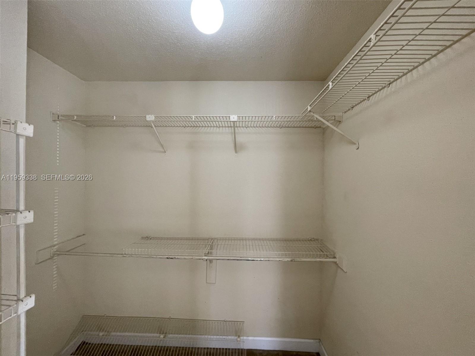 977 Riverside Drive, Unit 227 Coral Springs, FL 33071 - Photo 10 of 36 a view of a room with shelf