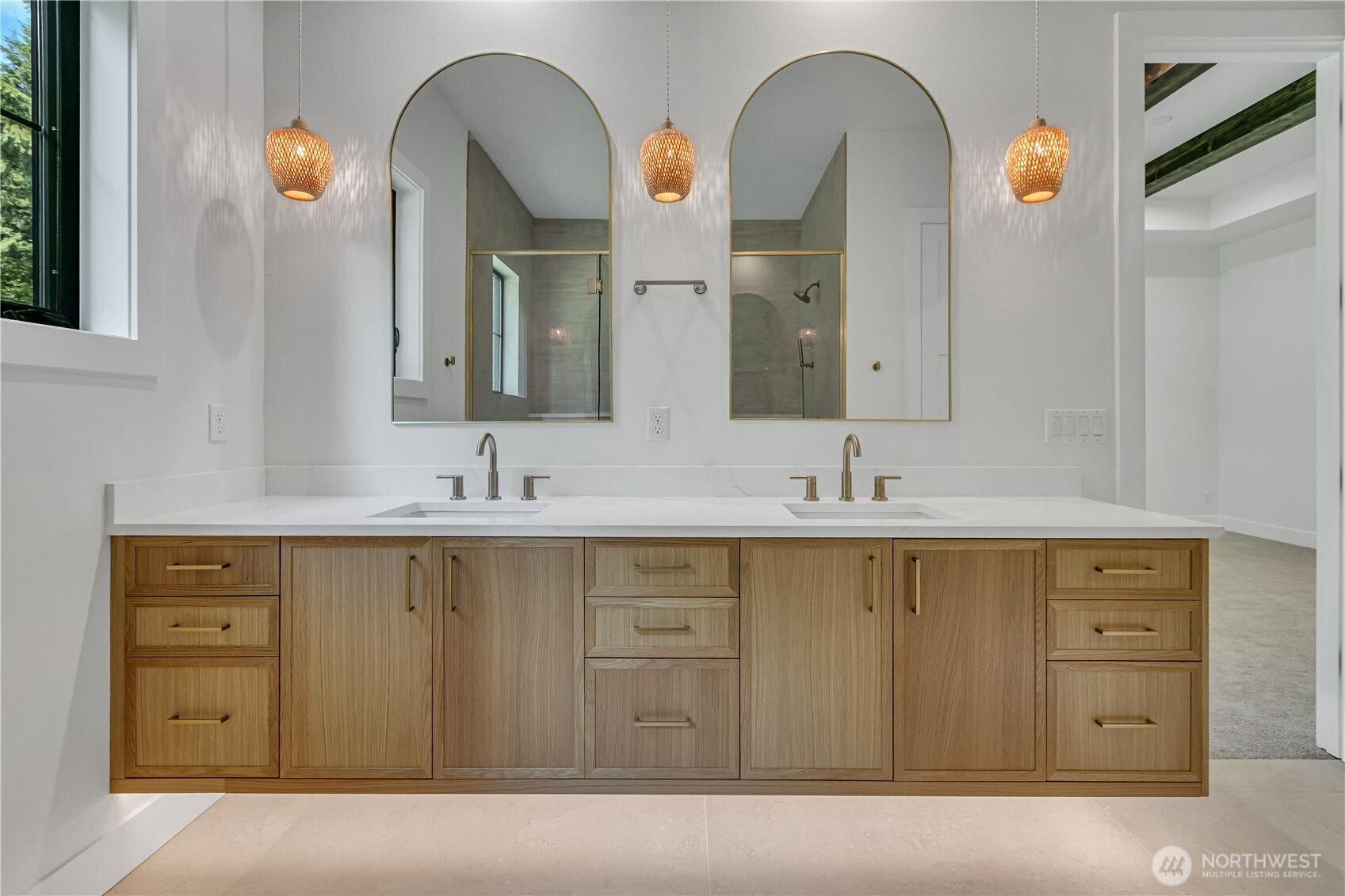 6709 254th Street East Graham, WA 98338 - Photo 22 of 40 a spacious bathroom with a double vanity sink and a mirror