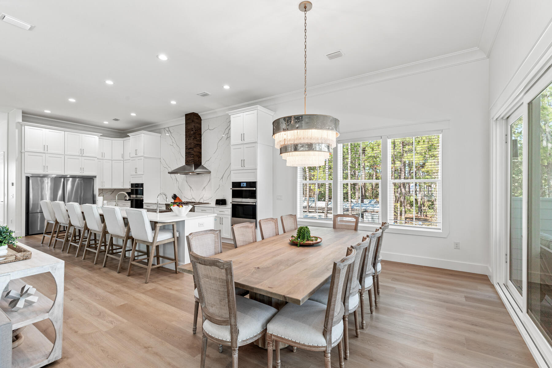 74 Shady Pines Drive Santa Rosa Beach, FL 32459 - Photo 22 of 51 a view of a dining room and livingroom with furniture wooden floor a chandelier