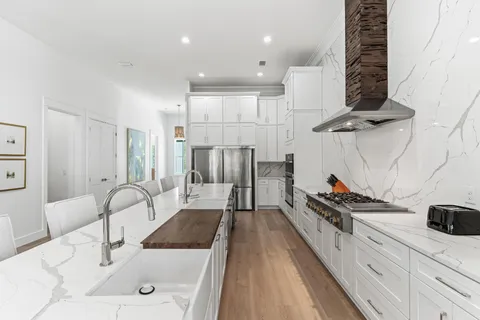 a bathroom with a sink a mirror and a shower