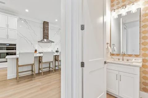 a spacious bathroom with a shower sink and mirror