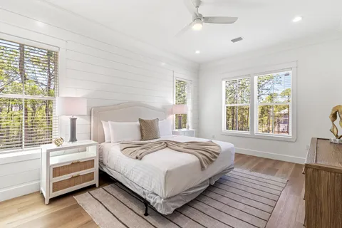 a bathroom with a double vanity sink mirror and shower
