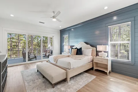a bathroom with double vanity sinks a mirror and a shower