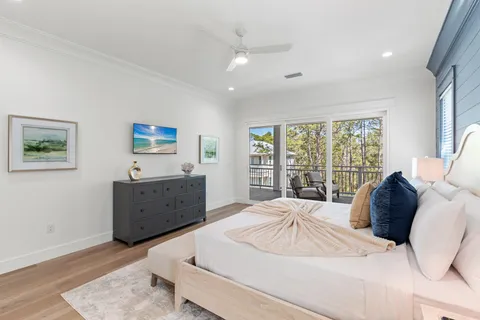 a balcony with wooden floor and outdoor seating