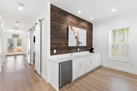 a bathroom with a double vanity sink and mirror