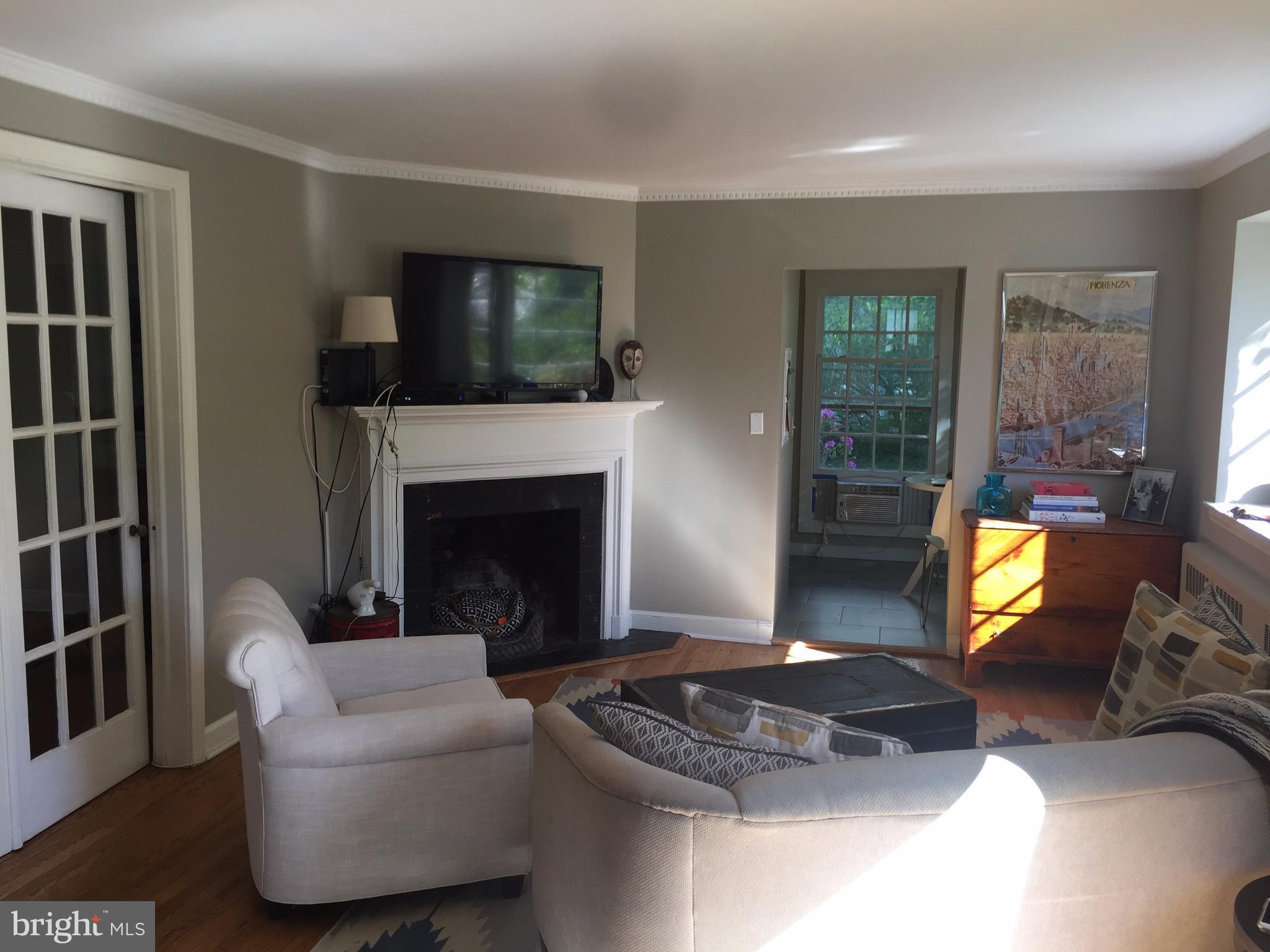2444 Pickwick Road Baltimore, MD 21207 - Photo 2 of 24 a living room with furniture and a flat screen tv