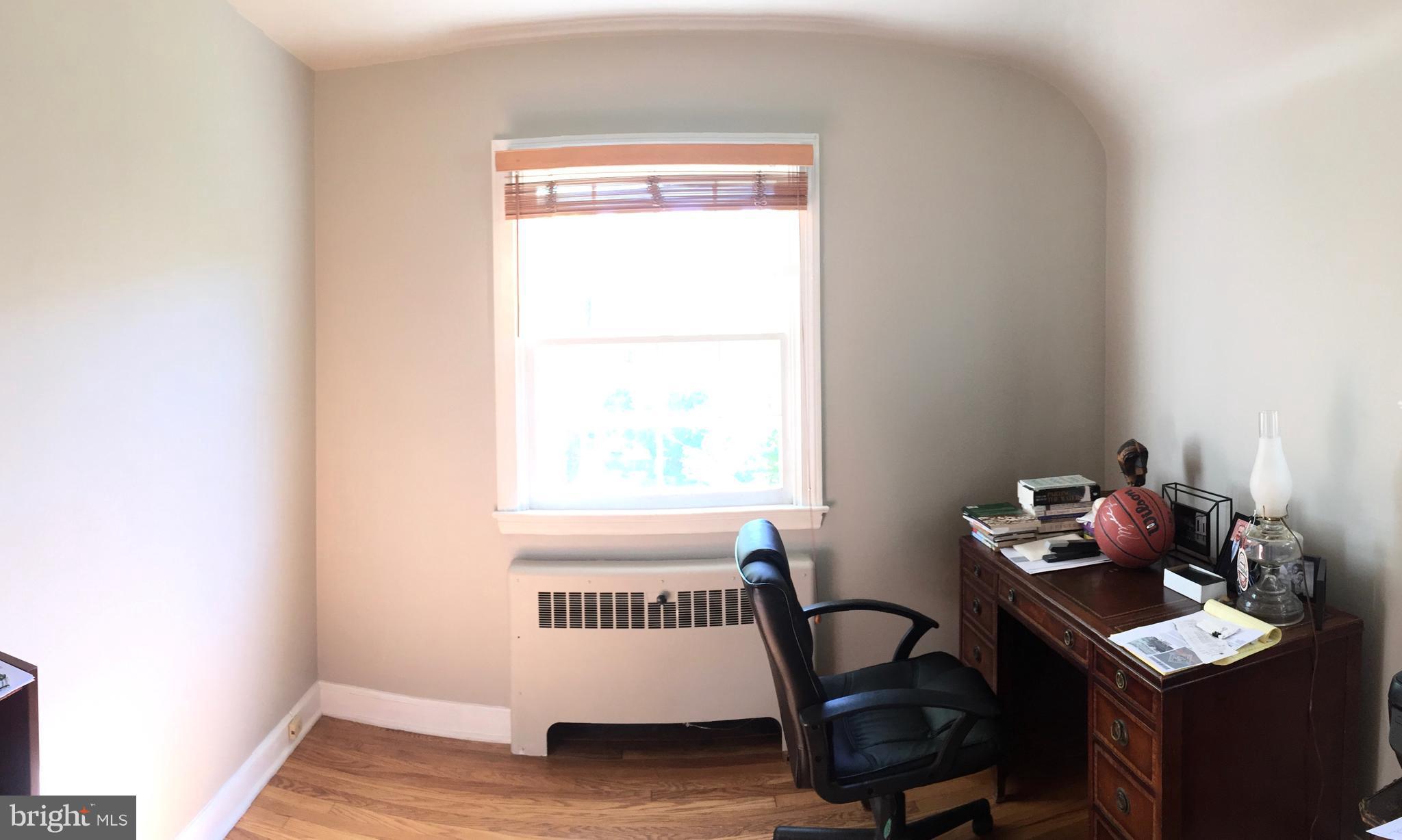 2444 Pickwick Road Baltimore, MD 21207 - Photo 18 of 24 a view of a workspace with furniture and a window