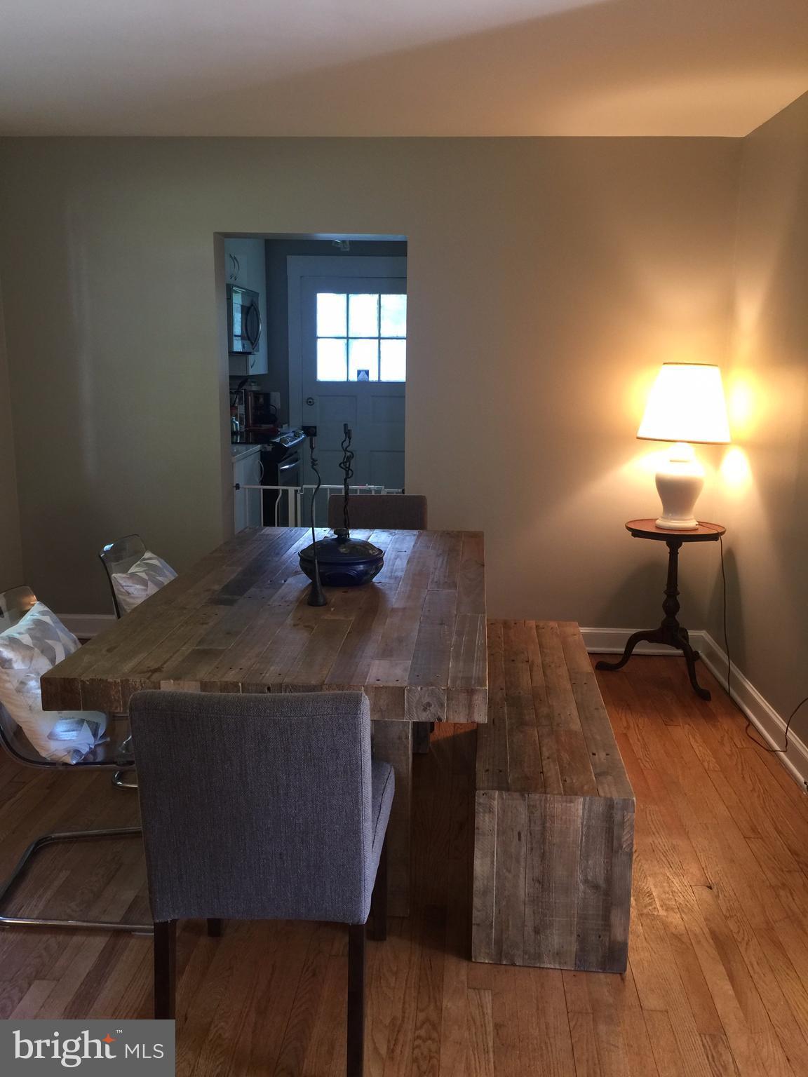 2444 Pickwick Road Baltimore, MD 21207 - Photo 3 of 24 a living room with furniture and a lamp