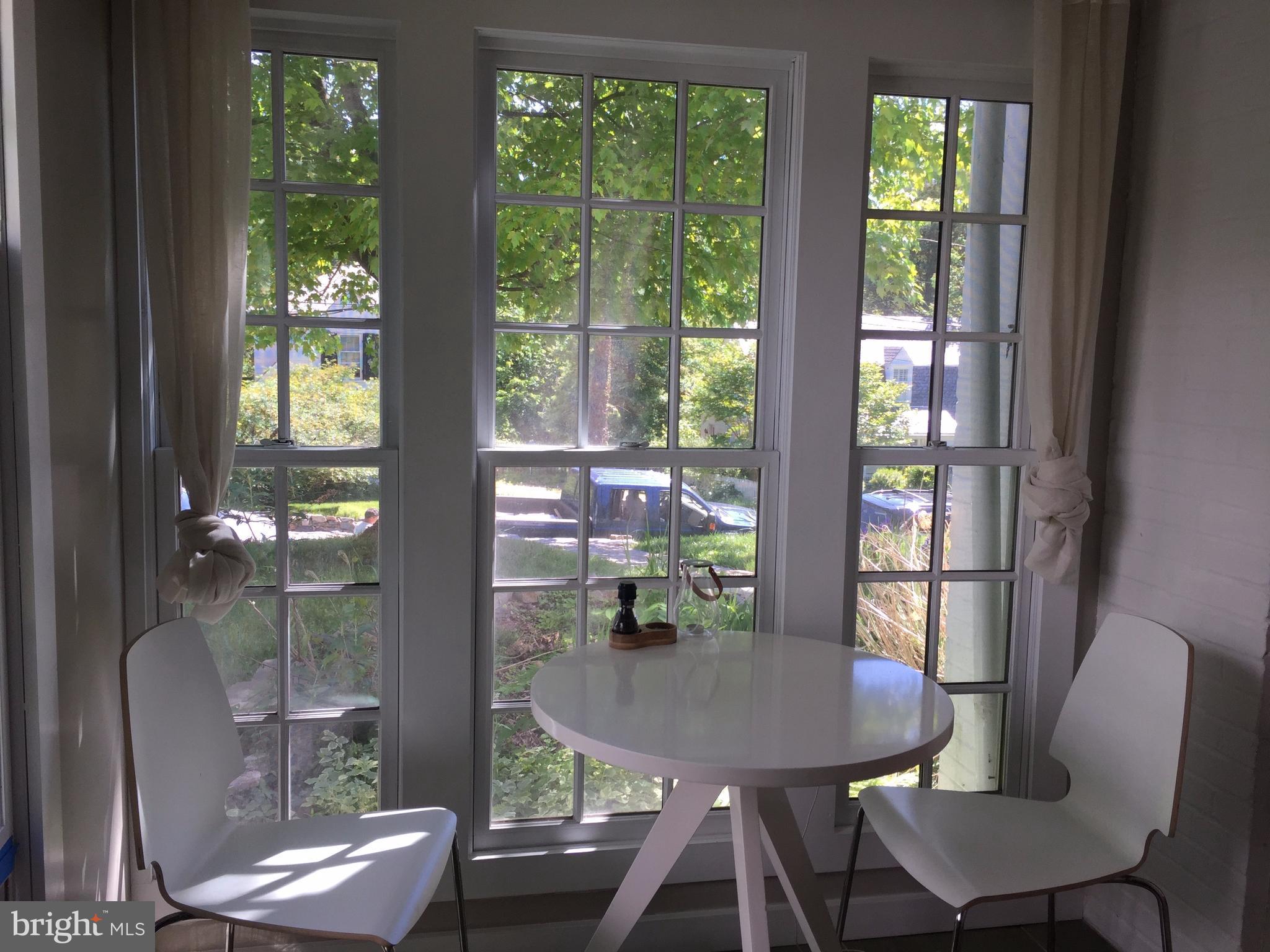2444 Pickwick Road Baltimore, MD 21207 - Photo 7 of 24 a view of a dining room with furniture window and outside view