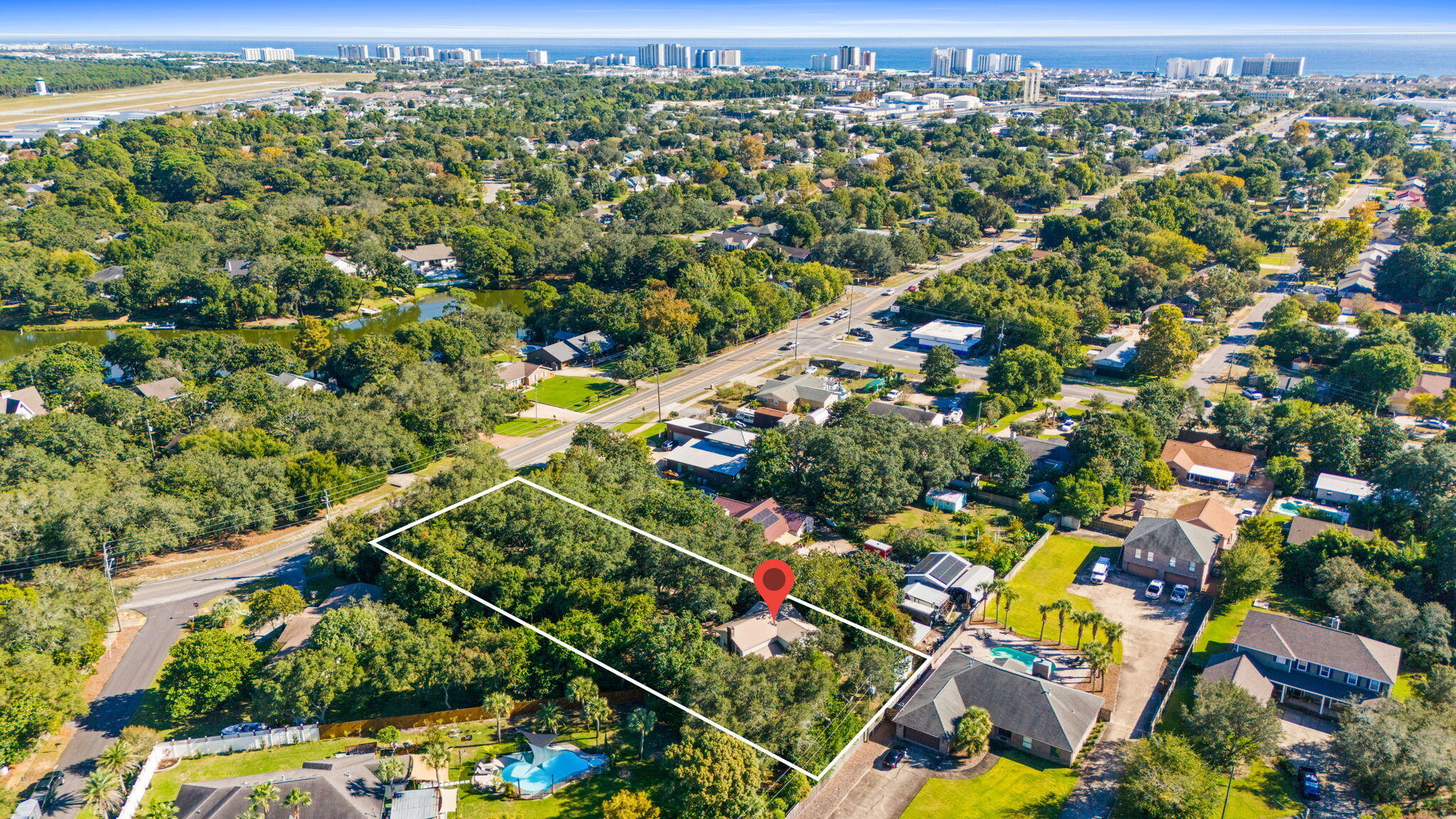 517 Main Street Destin, FL 32541 - Photo 3 of 14 an aerial view of residential houses with outdoor space