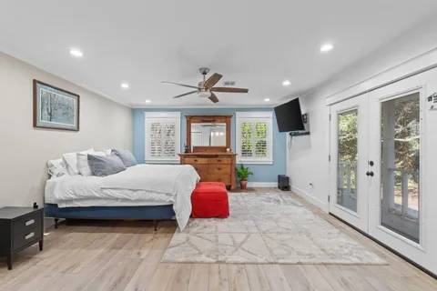 a spacious bedroom with a large bed and a window